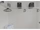 Walk-in closet provides ample storage with shelving, clothing rods and decorative storage bins at 228 Dove Cottage Ln, Cary, NC 27519
