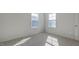 Bright bedroom with plush carpet and large window allowing for ample natural light at 2314 Sugar Cone Way, Fuquay Varina, NC 27526