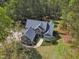 An aerial view of the lovely house with a manicured lawn, beautiful landscaping, and a wooded area at 250 Highview Dr, Youngsville, NC 27596