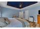 Cozy bedroom featuring a ceiling fan, wood floors, and serene blue walls for ultimate comfort and relaxation at 250 Highview Dr, Youngsville, NC 27596