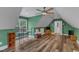 Spacious bonus room with hardwood floors, a seating area, and a TV at 250 Highview Dr, Youngsville, NC 27596
