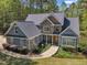 A beautiful home with a stone and siding exterior, a well-manicured lawn, and a charming walkway at 250 Highview Dr, Youngsville, NC 27596