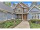 Lovely home featuring a stone facade, covered front porch, and manicured landscaping at 250 Highview Dr, Youngsville, NC 27596