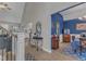 Hallway leading to dining area, showcasing hardwood floors, neutral walls, and an elegant table at 250 Highview Dr, Youngsville, NC 27596