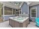 Backyard hot tub, with a covered patio area and well-maintained exterior at 250 Highview Dr, Youngsville, NC 27596