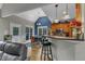 Lovely kitchen with stainless appliances, bar seating and adjacent dining nook with backyard view at 250 Highview Dr, Youngsville, NC 27596