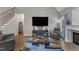 Cozy living room with fireplace, high ceilings and large TV at 250 Highview Dr, Youngsville, NC 27596