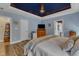 Spacious main bedroom features tray ceiling, updated fixtures, and ensuite bathroom at 250 Highview Dr, Youngsville, NC 27596