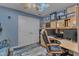 Cozy home office with lots of natural light, built-in shelves and drawers, and wood flooring at 250 Highview Dr, Youngsville, NC 27596