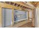 Outdoor shower with sink, bench, and curtain for privacy on the covered wooden deck at 250 Highview Dr, Youngsville, NC 27596