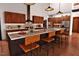 Gourmet kitchen equipped with custom cabinets, stainless steel appliances, granite countertops and a central island at 2637 Buckeye Ct, Wake Forest, NC 27587