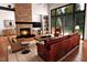 Bright living room showcasing a stone fireplace, high ceilings, recessed lighting, and views of the outdoor landscape at 2637 Buckeye Ct, Wake Forest, NC 27587