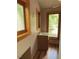 Small bathroom area featuring a sink, a window, and wood accents at 2811 Chicken Bridge Rd, Pittsboro, NC 27312