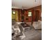 Cozy living room features wood walls and ceilings, with a small sink and shelving at 2811 Chicken Bridge Rd, Pittsboro, NC 27312