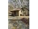 Quaint wooden shed with a metal roof and double doors surrounded by trees at 2811 Chicken Bridge Rd, Pittsboro, NC 27312