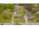 Aerial view of the property showing the surrounding landscape, street, and neighborhood at 311 Culvert St, Apex, NC 27502