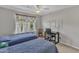 Bedroom featuring two twin beds, natural light from the window, and a functional study area at 345 Red Elm Dr, Durham, NC 27713