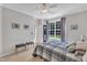 Bedroom featuring neutral walls, plush carpeting, and a comfortable bed with a large window view at 345 Red Elm Dr, Durham, NC 27713