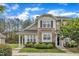 Charming townhome with stone accents, manicured landscaping, and inviting entrance under a blue sky at 345 Red Elm Dr, Durham, NC 27713