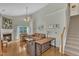 Cozy living room with a fireplace, high ceilings, and a staircase at 345 Red Elm Dr, Durham, NC 27713