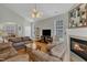 Cozy living room with fireplace, ceiling fan, and comfortable seating at 345 Red Elm Dr, Durham, NC 27713
