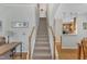 Open staircase with carpeted steps and hardwood floors leading to an upper level at 345 Red Elm Dr, Durham, NC 27713