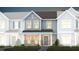 Charming townhome featuring hardiplank siding, a covered entryway and professional landscaping at 351 Fosterton Cottage Way, Raleigh, NC 27603