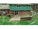 Spacious backyard with large wooden deck, offering privacy and outdoor entertaining options at 3518 Donnigale Ave, Durham, NC 27705