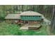 View of a large wooden deck and backyard showcasing outdoor living space and manicured lawn at 3518 Donnigale Ave, Durham, NC 27705