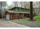 A well-maintained home with brick accents, attached garage, and landscaped front yard and long driveway at 3518 Donnigale Ave, Durham, NC 27705