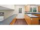 Spacious kitchen with dark countertops, wooden cabinets, and a convenient pass-through to the back deck at 3518 Donnigale Ave, Durham, NC 27705