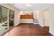 Bright living room with hardwood floors, sliding door access to the deck, and an open view to the kitchen at 3518 Donnigale Ave, Durham, NC 27705