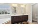 Bright bathroom features a double sink vanity, soaking tub, and neutral tile flooring at 4008 Sykes St, Cary, NC 27519