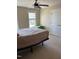 Comfortable bedroom with neutral tones, ceiling fan, and ample natural light from the window at 4008 Sykes St, Cary, NC 27519