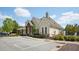 Well-maintained clubhouse exterior with parking and manicured landscaping at 4008 Sykes St, Cary, NC 27519