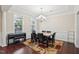 Formal dining room featuring a chandelier, a large window, and elegant furnishings at 4008 Sykes St, Cary, NC 27519