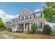 Beautiful two-story brick home with a well-manicured lawn and inviting front porch at 4008 Sykes St, Cary, NC 27519