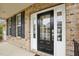 Inviting front door with sidelights, showcasing the home's architectural details and curb appeal at 4008 Sykes St, Cary, NC 27519