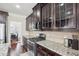 Kitchen with stainless steel oven, granite countertops and dark wood cabinets at 4008 Sykes St, Cary, NC 27519