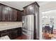Stainless steel refrigerator with wood cabinets and granite countertops at 4008 Sykes St, Cary, NC 27519