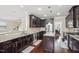 A kitchen featuring stainless steel appliances, granite countertops, dark wood cabinetry, and a center island with pendant lighting at 4008 Sykes St, Cary, NC 27519