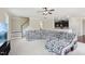 Living room featuring a blanket-covered sectional sofa and an open-concept design leading to the kitchen at 4008 Sykes St, Cary, NC 27519