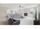 A cozy living room featuring a fireplace, a sectional sofa, neutral walls, and an open-concept design at 4008 Sykes St, Cary, NC 27519