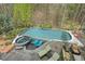 Overhead perspective of a luxurious pool and spa, complemented by an inviting outdoor lounge space with upscale furnishings at 417 Westbury Dr, Chapel Hill, NC 27516