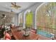 Covered balcony with outdoor seating, view of the pool, and wooded surroundings at 417 Westbury Dr, Chapel Hill, NC 27516