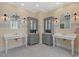 Elegant bathroom featuring dual vanities, custom cabinets, and decorative mirrors at 417 Westbury Dr, Chapel Hill, NC 27516