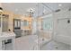 A spacious bathroom features a white tiled shower, dual vanities, and a bathtub at 417 Westbury Dr, Chapel Hill, NC 27516