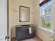 Charming powder room featuring a vanity with granite countertop and natural light at 417 Westbury Dr, Chapel Hill, NC 27516