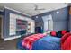 Cozy bedroom featuring custom built-in shelving, a bed, and natural light at 417 Westbury Dr, Chapel Hill, NC 27516