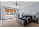 This is a beautifully decorated bedroom with a hanging chair and large windows at 417 Westbury Dr, Chapel Hill, NC 27516